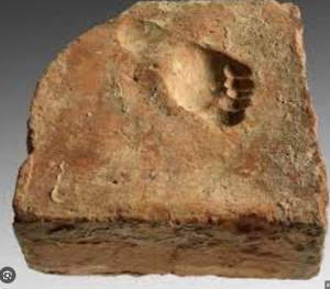 A Roman toddler's footprint in a red clay tile