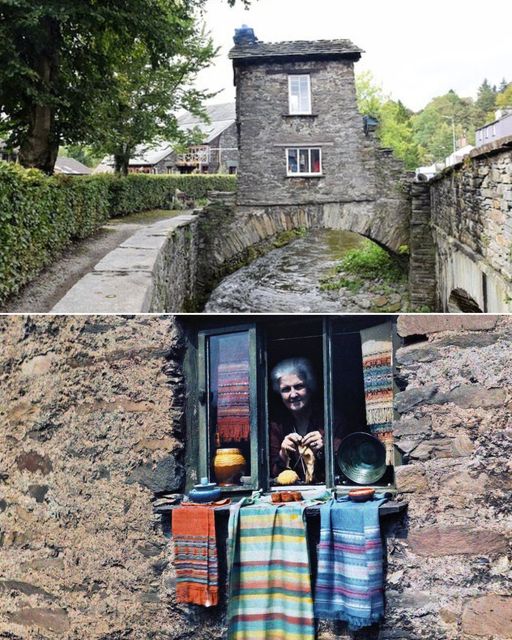 A woman sticks her head out of her bridge house window