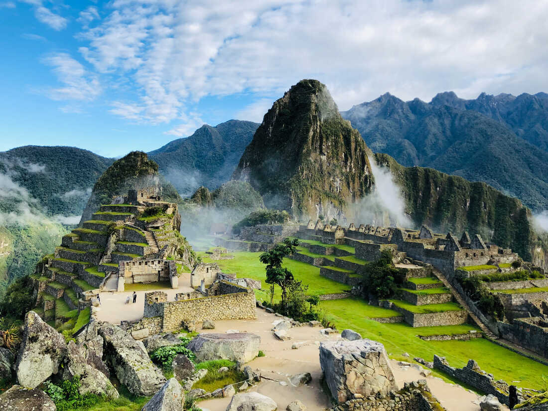 The Inca citadel of Machu Picchu in the early morning light with Huayna Picchu mountain in the background